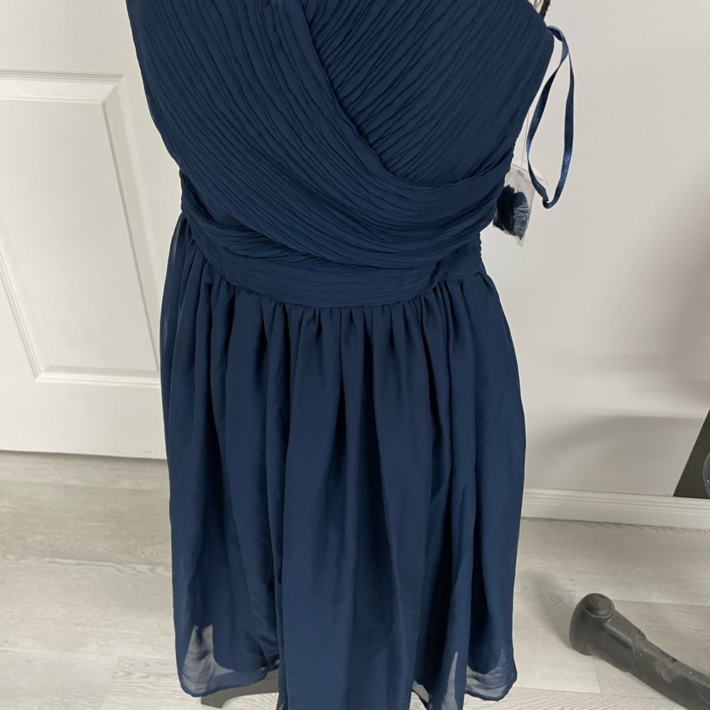 Navy cocktail dress never worn.
